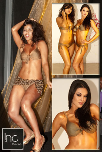 Female dancers sprayed in bronz metallic paint